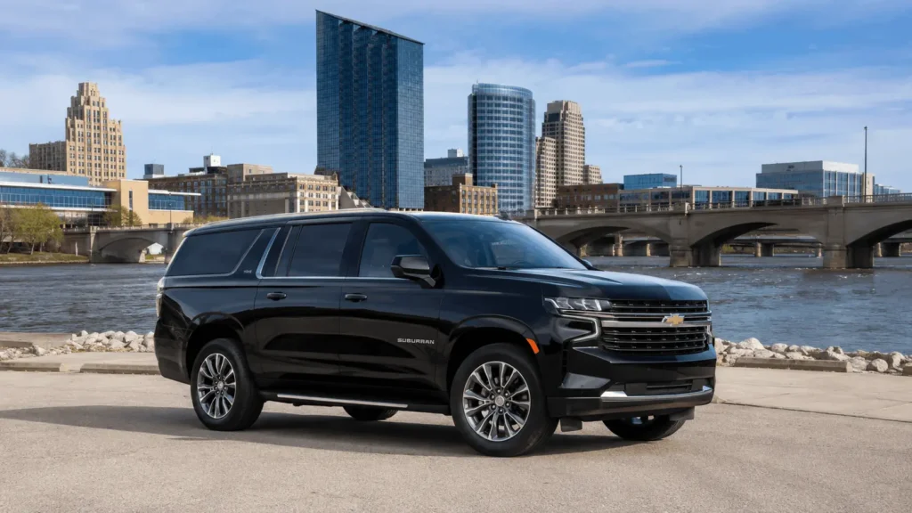 Sleek SUV by city river and bridge